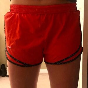 Red Nike running shorts